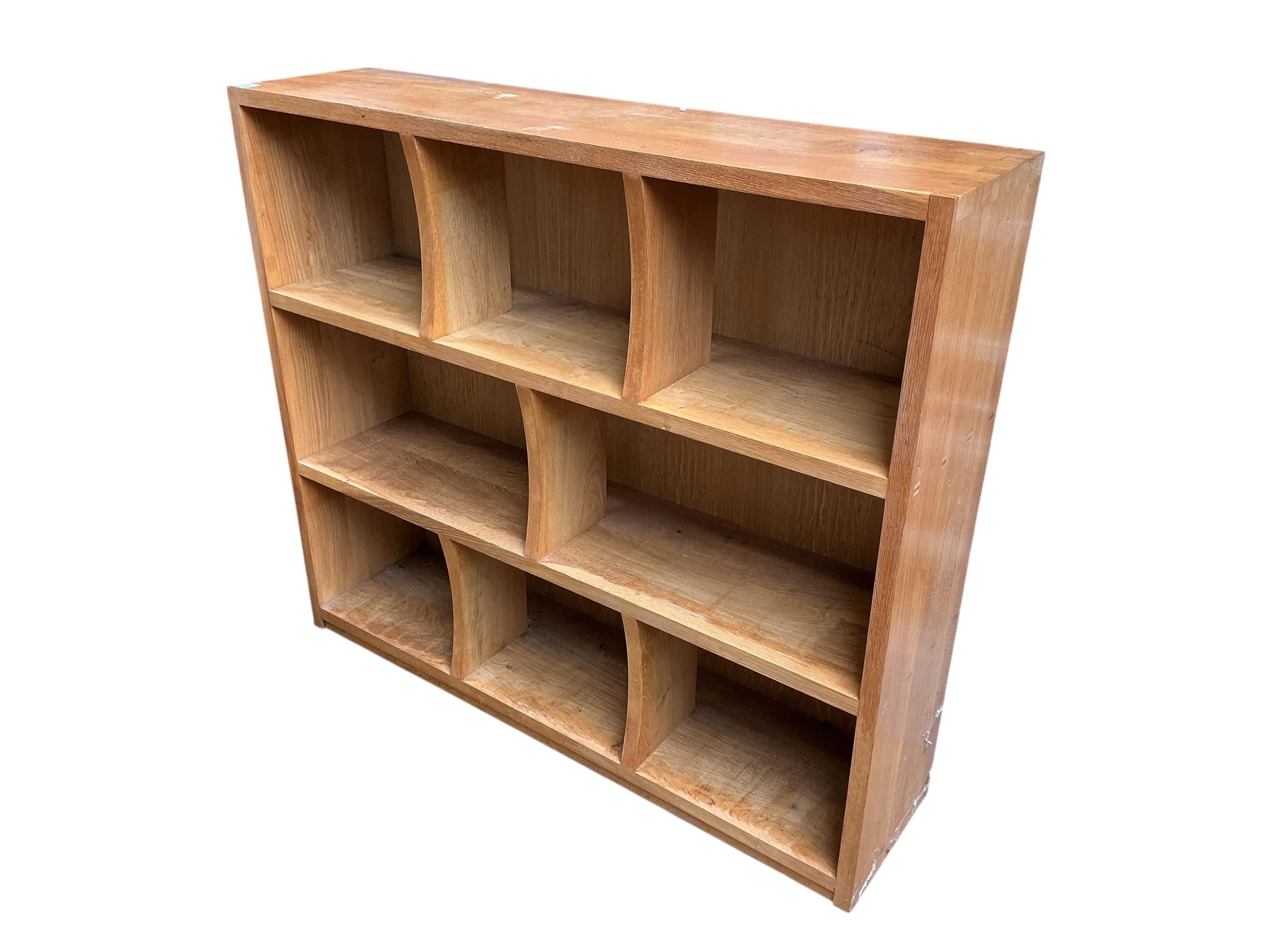 A pair of bespoke oak open bookcases, each width 132cm, depth 30cm, height 107cm